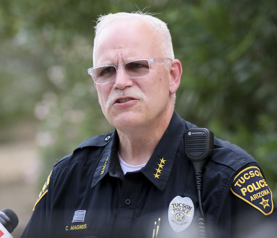 Chief Chris Magnus, of the Tucson Police Department, speaks about a shooting that took place onboard an Amtrak train at the Historic Tucson Train Depot in downtown Tucson, Ariz., that left one Drug Enforcement Administration agent dead and another one injured on Monday, Oct. 4, 2021. A Tucson Police Department officer was injured but is in stable condition. Tucson police say, one suspect was killed and another is in custody. (Mamta Popat/Arizona Daily Star via AP)