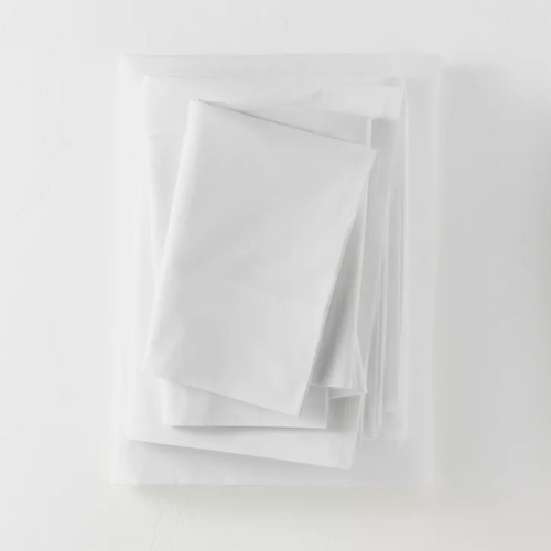 folded white Supima Percale Solid sheet set against white background