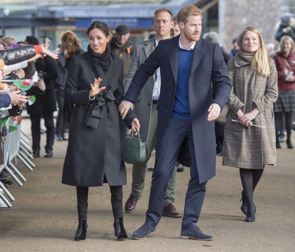 Amy Pickerill (right) with Prince Harry and Meghan Markle in Cardiff, Wales, on Jan. 18, 2008.