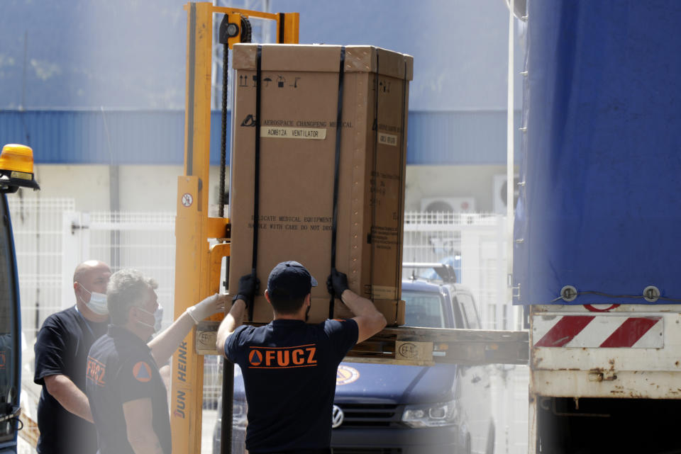 Civil protection workers move boxes of ventilators at the customs post in the Bosnia capital Sarajevo, Thursday, April 30, 2020. In their initial report, the Bosnian state prosecutors said in a statement released Monday May 11, 2020, that the ventilators imported from China by private company Silver Raspberry, and paid for by the country’s government, have been found to be useless for COVID-19 coronavirus patients. (AP Photo)