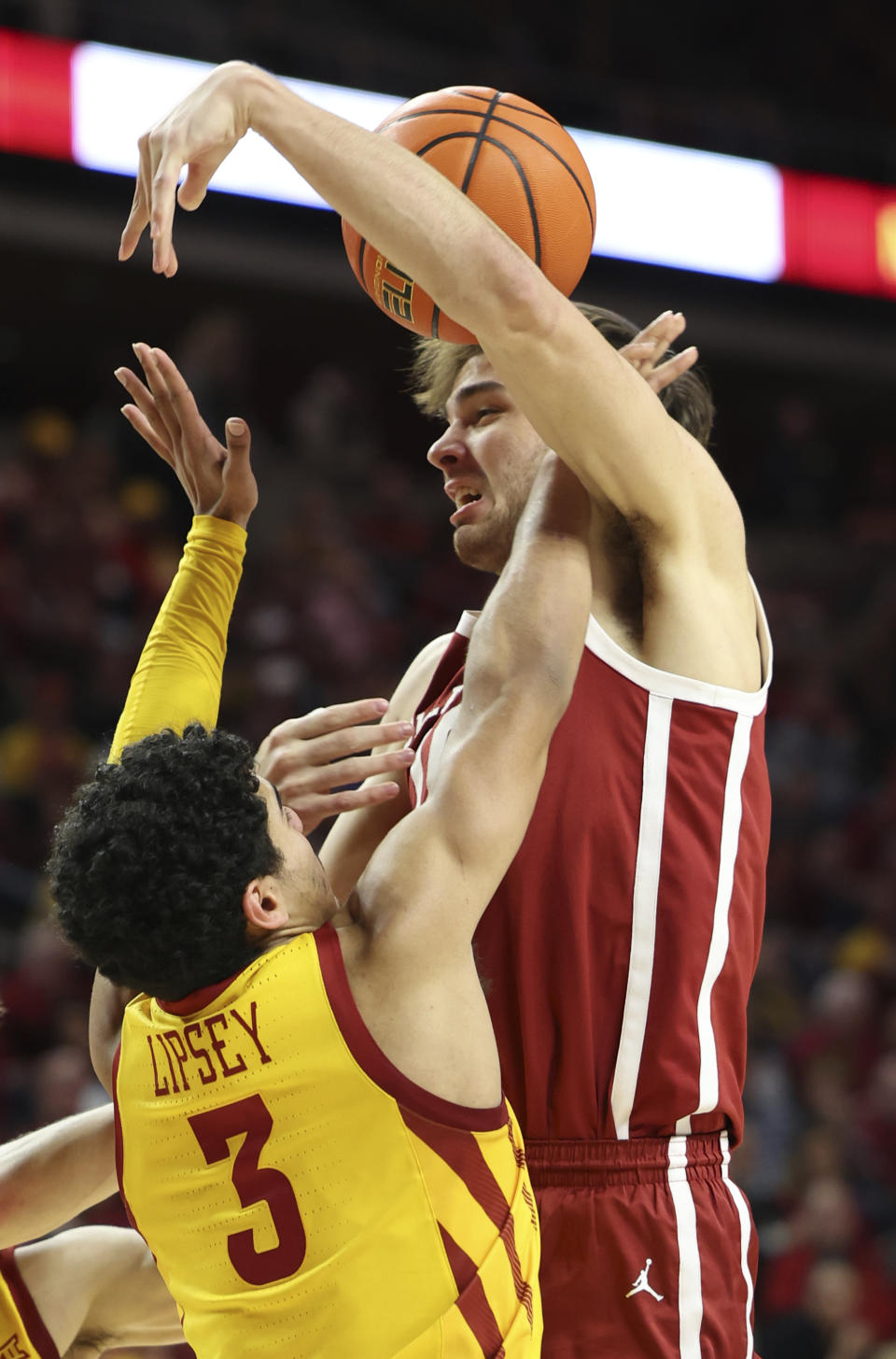 Iowa State guard Tamin Lipsey (3) knocks the ball away from Oklahoma forward Sam Godwin (10) during the second half of an NCAA college basketball game, Saturday, Feb. 25, 2023, in Ames, Iowa. (AP Photo/Justin Hayworth)