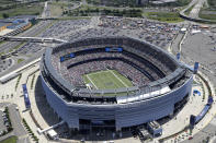 FILE - This is an aerial view showing MetLife Stadium in East Rutherford, N.J., June 20, 2014. There are 23 venues bidding to host soccer matches at the 2026 World Cup in the United States, Mexico and Canada. (AP Photo/Seth Wenig, File)