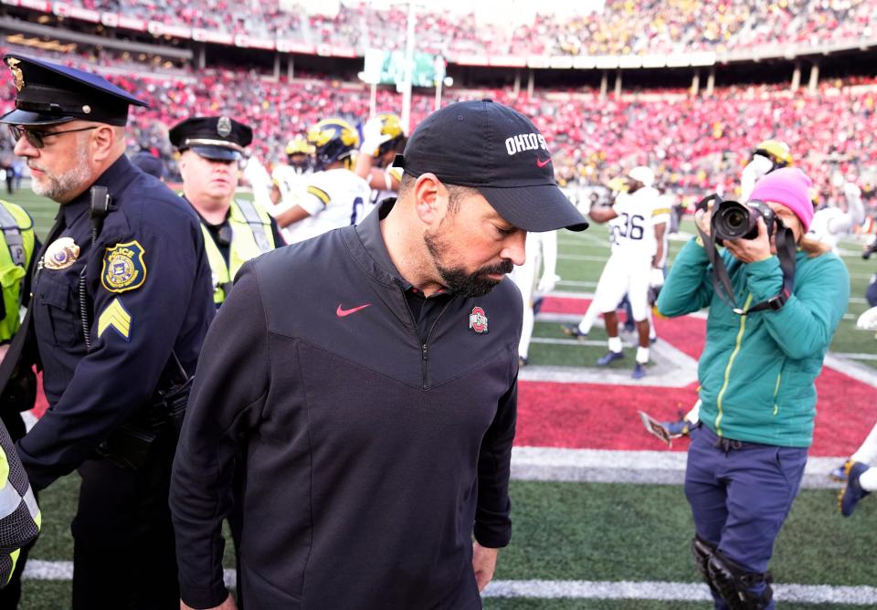 Ohio State coach Ryan Day walks away after the postgame handshake with Michigan coach Jim Harbaugh after a 45-23 loss at Ohio Stadium.