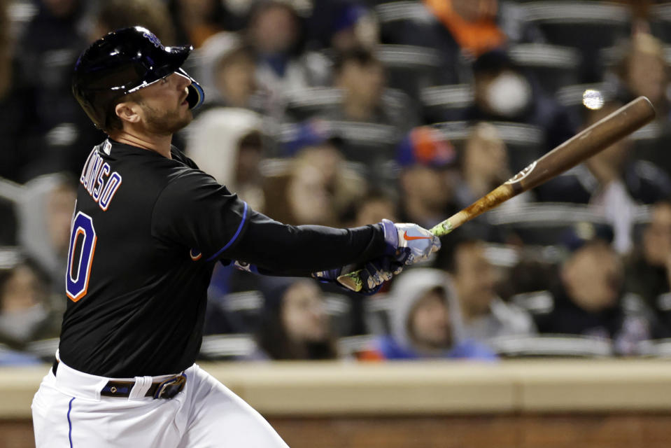 New York Mets' Pete Alonso watches a home run during the sixth inning of the team's baseball game against the Philadelphia Phillies on Friday, April 29, 2022, in New York. (AP Photo/Adam Hunger)