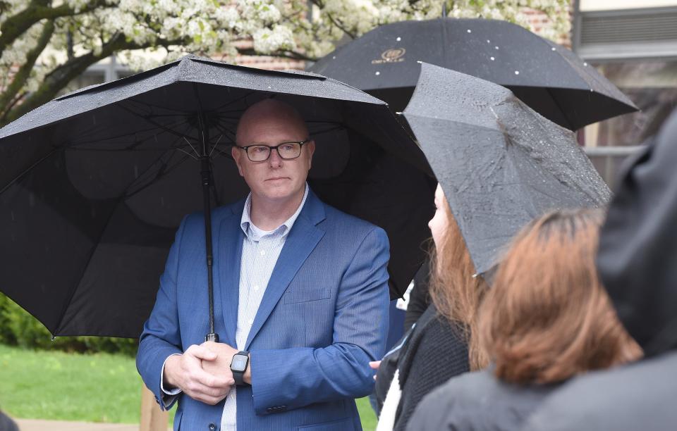 Monroe Public Schools Superintendent Andrew Shaw listens to complaints of bullying at April's "Justice for Gary" anti-bullying rally at Monroe Middle School. Since the rally, Shaw and others at MPS have been addressing bullying.