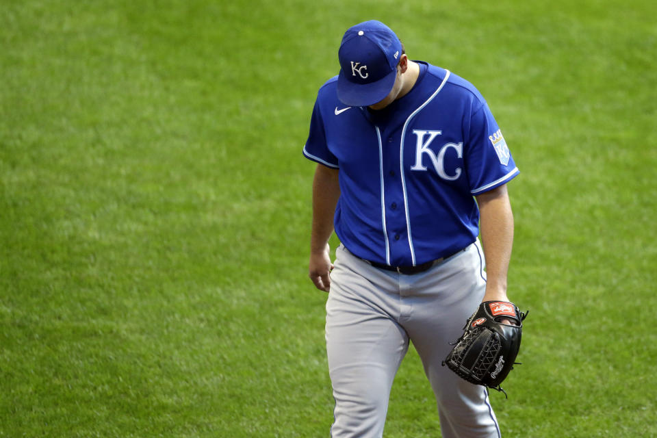 Kansas City Royals' Brad Keller walks to the dugout after being removed from the game during the sixth inning of a baseball game against the Milwaukee Brewers Sunday, Sept. 20, 2020, in Milwaukee. (AP Photo/Aaron Gash)