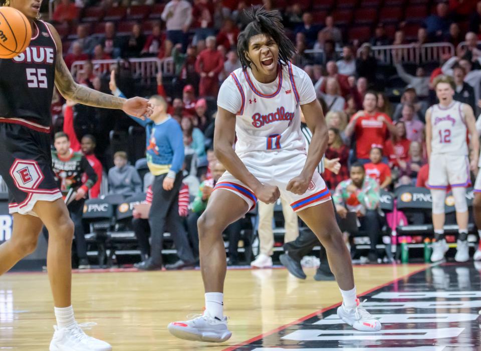 Bradley's Demarion Burch celebrates his slam dunk against SIU-Edwardsville late in the second half of their nonconference basketball game Thursday, Dec. 21, 2023 at Carver Arena. The Braves defeated the Cougars 75-64.