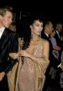 <p>With Val Kilmer in a nude sequin gown at the Oscars.</p>