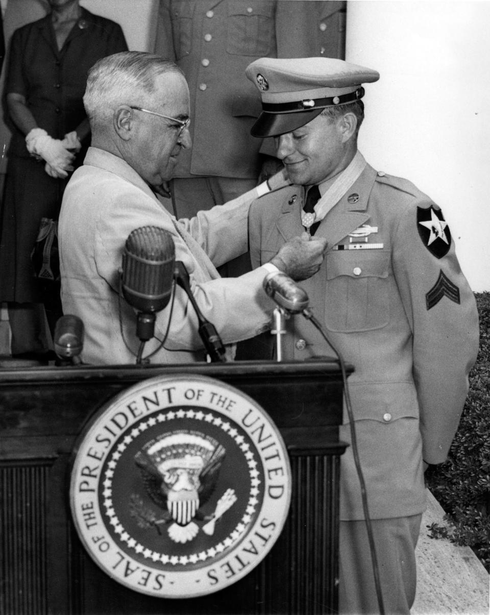 President Harry S. Truman presents Corporal Ronald Rosser with the Medal of Honor on June 29, 1952.