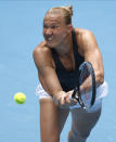 Estonia's Kaia Kanepi makes a backhand return to United States' Sofia Kenin during their second round match at the Australian Open tennis championship in Melbourne, Australia, Thursday, Feb. 11, 2021.(AP Photo/Rick Rycroft)