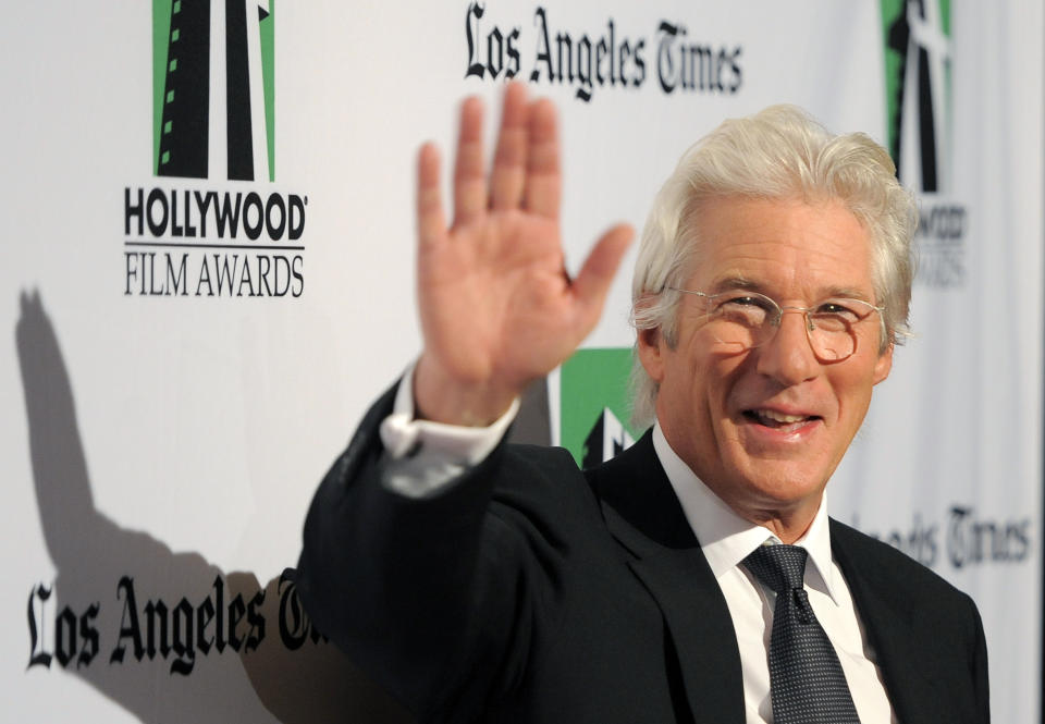 Richard Gere, recipient of the Hollywood Career Achievement Award, waves to photographers at the 16th Annual Hollywood Film Awards Gala on Monday, Oct. 22, 2012, in Beverly Hills, Calif. (Photo by Chris Pizzello/Invision/AP)