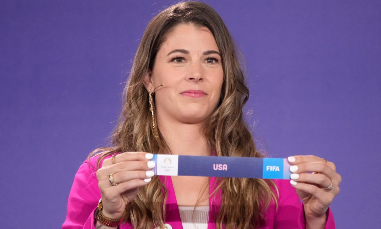 <span>Stephanie Labbe draws USA during the draw for the Paris 2024 women’s soccer tournament.</span><span>Photograph: Christophe Ena/AP</span>