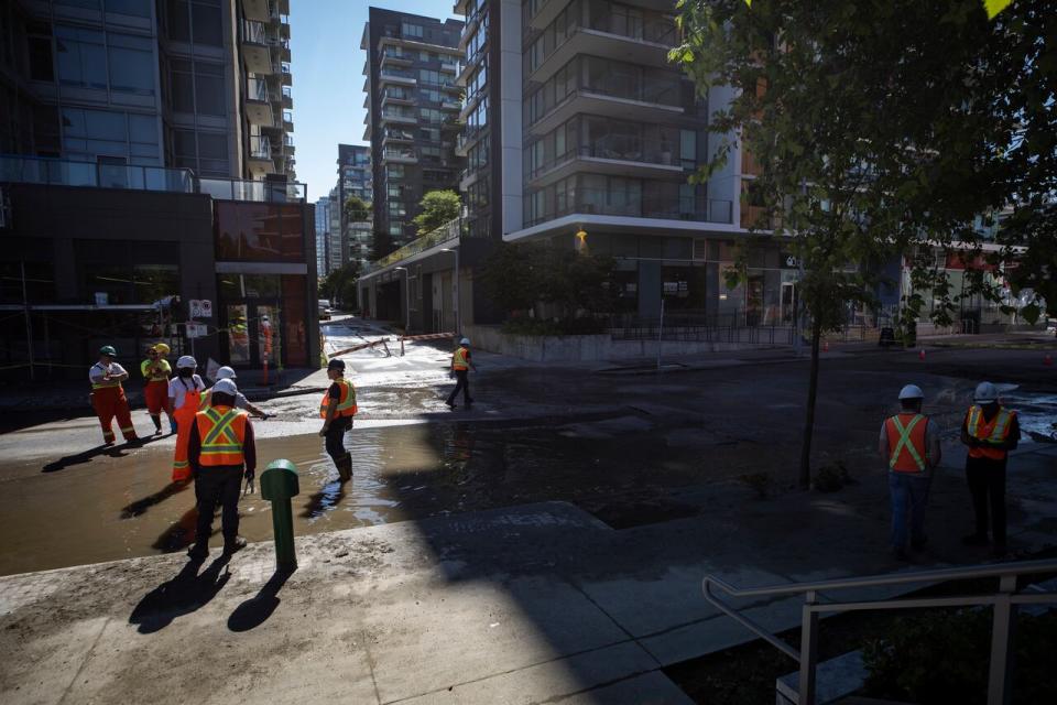 City crews are pictured working on a sewage main leak near False Creek in Vancouver, B.C., on Thursday June 20, 2024.