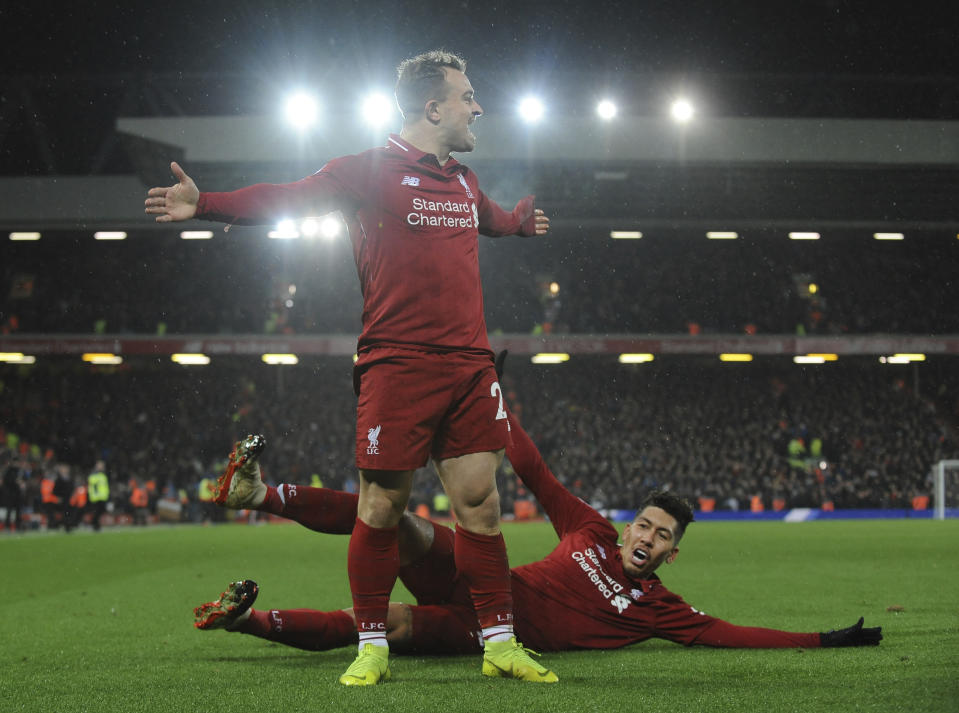 Liverpool's Xherdan Shaqiri celebrates after scoring his side's second goal during the English Premier League soccer match between Liverpool and Manchester United at Anfield in Liverpool, England, Sunday, Dec. 16, 2018. (AP Photo/Rui Vieira)