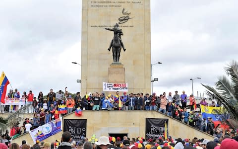 Venezuelan citizens living in Colombia protest against the presidential elections - Credit: Reuters