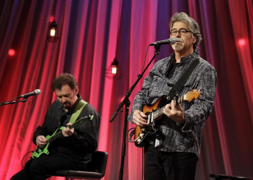 Randy Owen, right, and Jeff Cook of the group Alabama perform a song during a taping for Dolly Parton's Smoky Mountain Rise Telethon Tuesday, Dec. 13, 2016, in Nashville, Tenn. Parton has lined up an all-star list of performers for a three-hour telethon to raise money for thousands of people whose homes were damaged or destroyed in Tennessee wildfires. (AP Photo/Mark Humphrey)