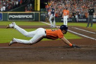 Houston Astros' Jose Siri scores on a throwing error during the second inning in Game 2 of baseball's World Series between the Houston Astros and the Atlanta Braves Wednesday, Oct. 27, 2021, in Houston. (AP Photo/Eric Gay)