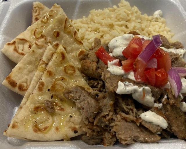 Freshly sliced gyro meat from a spit with tzatziki sauce, rice, pita bread and rice from Olympia Gyros at 670 Lake Joy Road, Suite 150, in Warner Robins
