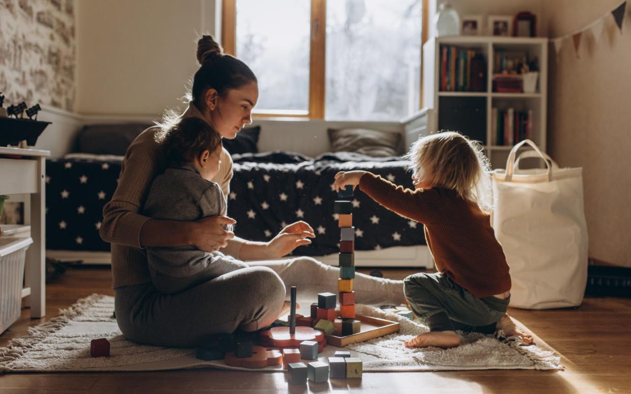 Young Mother playing with children