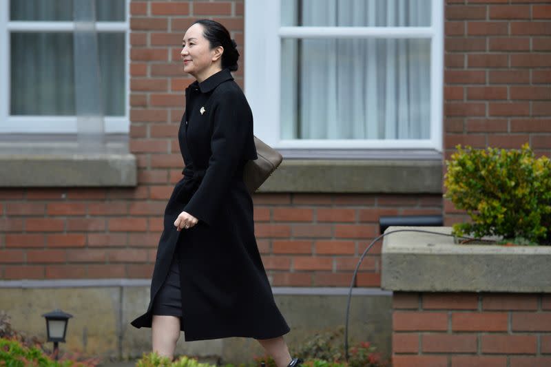 Huawei CFO Meng leaves her home to attend her extradition hearing in Vancouver