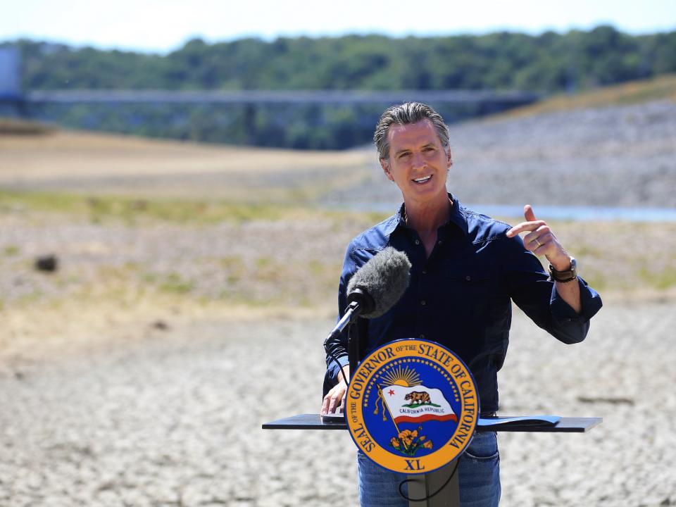 <p>California Gov Gavin Newsom speaks at a news conference in the parched basin of Lake Mendocino in Ukiah, California on Wednesday, 21 April 2021</p> (AP)