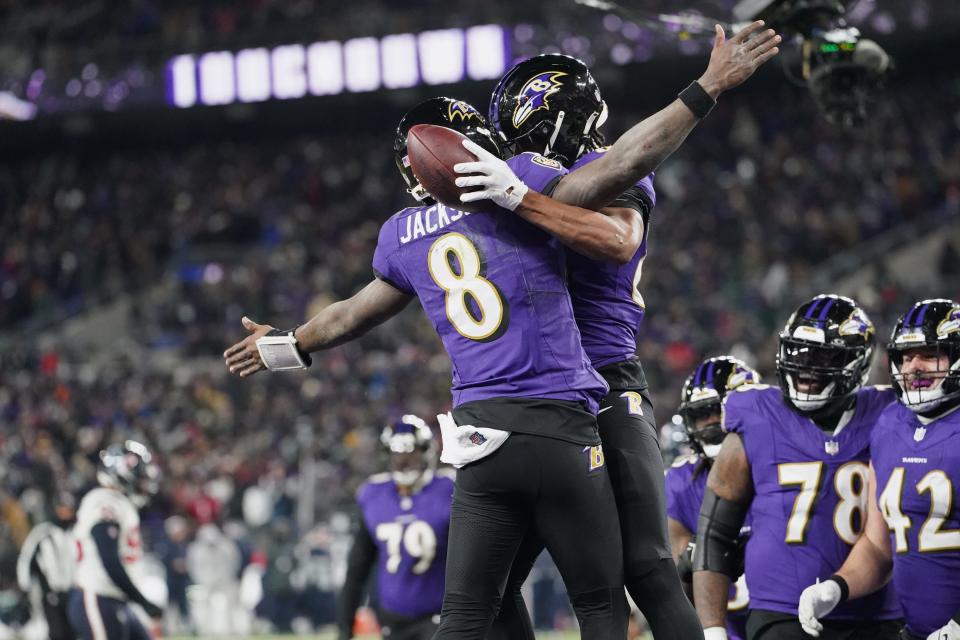 Ravens tight end Isaiah Likely (80) celebrates with quarterback Lamar Jackson (8) after a touchdown against the Texans during the fourth quarter of their AFC divisional round game at M&T Bank Stadium in Baltimore on Jan. 20, 2024.