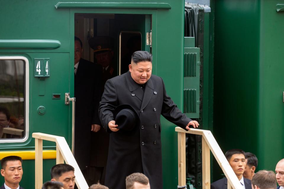 North Korea's leader Kim Jong Un leaves a train carriage after arriving at the border station of Khasan, Primorsky Krai region, Russia, on April 24, 2019.