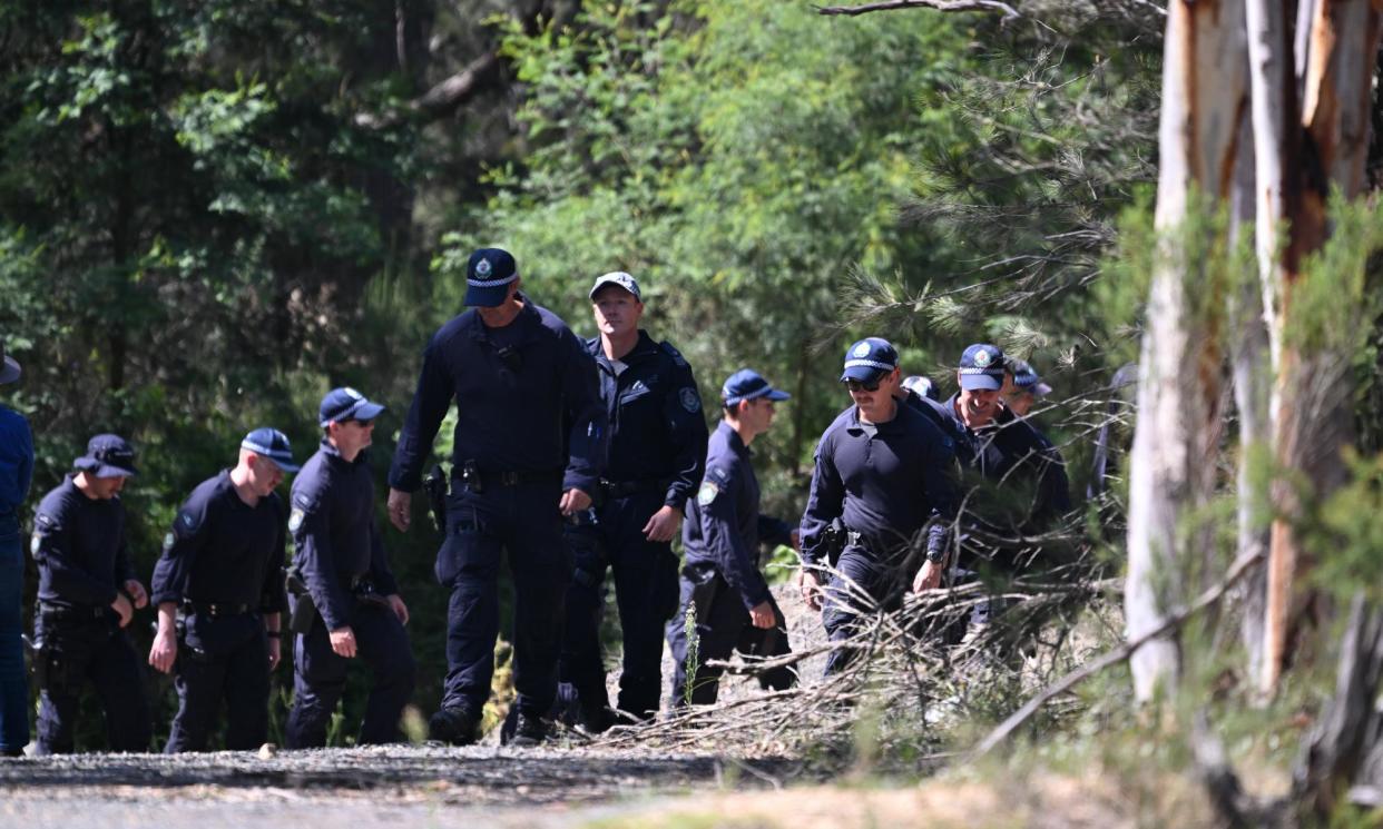 <span>NSW police conduct a line search at the Bungonia property where the bodies of Jesse Baird and Luke Davies were found earlier this week.</span><span>Photograph: Dean Lewins/EPA</span>