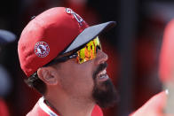 Los Angeles Angels' Anthony Rendon talks with teammates before a spring training baseball game against the San Diego Padres, Thursday, Feb. 27, 2020, in Tempe, Ariz. (AP Photo/Darron Cummings)