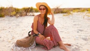 Woman-Wearing-Romper-At-Beach-Stock-Photo