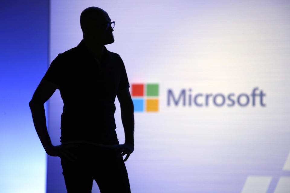 Microsoft CEO Satya Nadella looks on during a video as he delivers the keynote address at Build, the company's annual conference for software developers Monday, May 7, 2018, in Seattle. (AP Photo/Elaine Thompson)