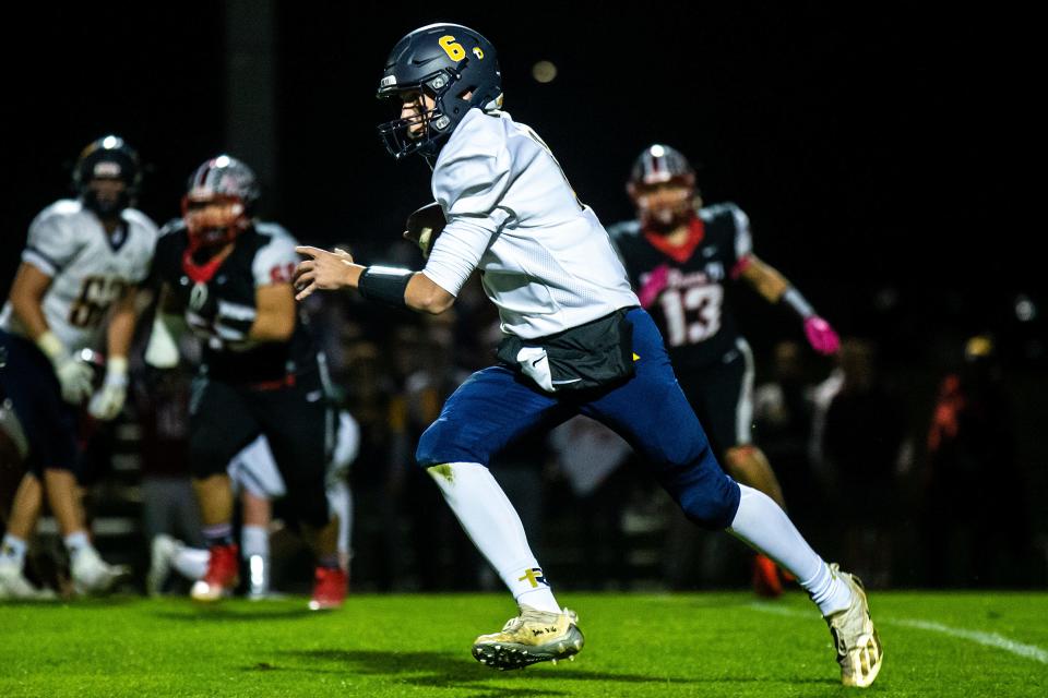 Iowa City Regina quarterback Gentry Dumont, shown during a game against West Branch on Oct. 7, is leading the Regals into the playoffs Friday, with a first-round game at Pella Christian.