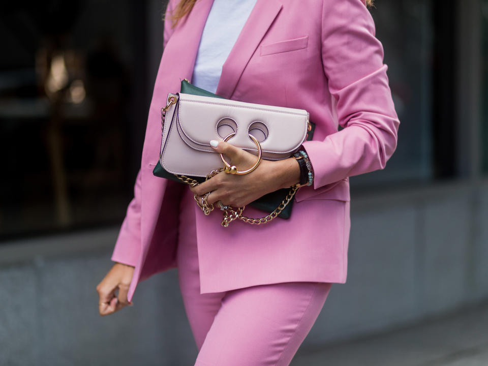 <p>A pink Pierce bag paired with a pink suit.</p>