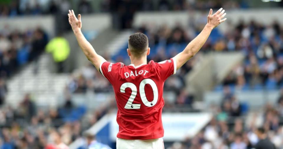 Man Utd defender Diogo Dalot throws his hands up in the air Credit: PA Images
