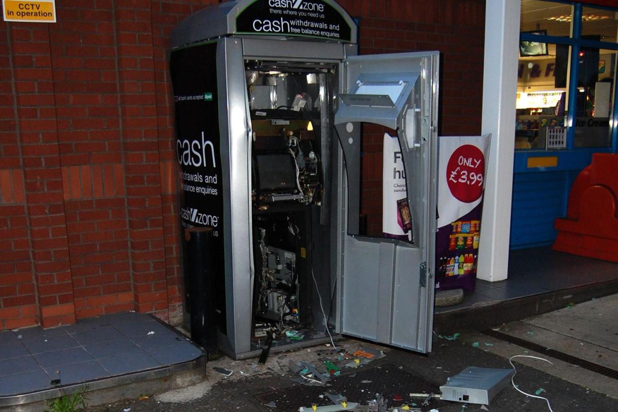 A cash point that was blown apart by the gang: Met police