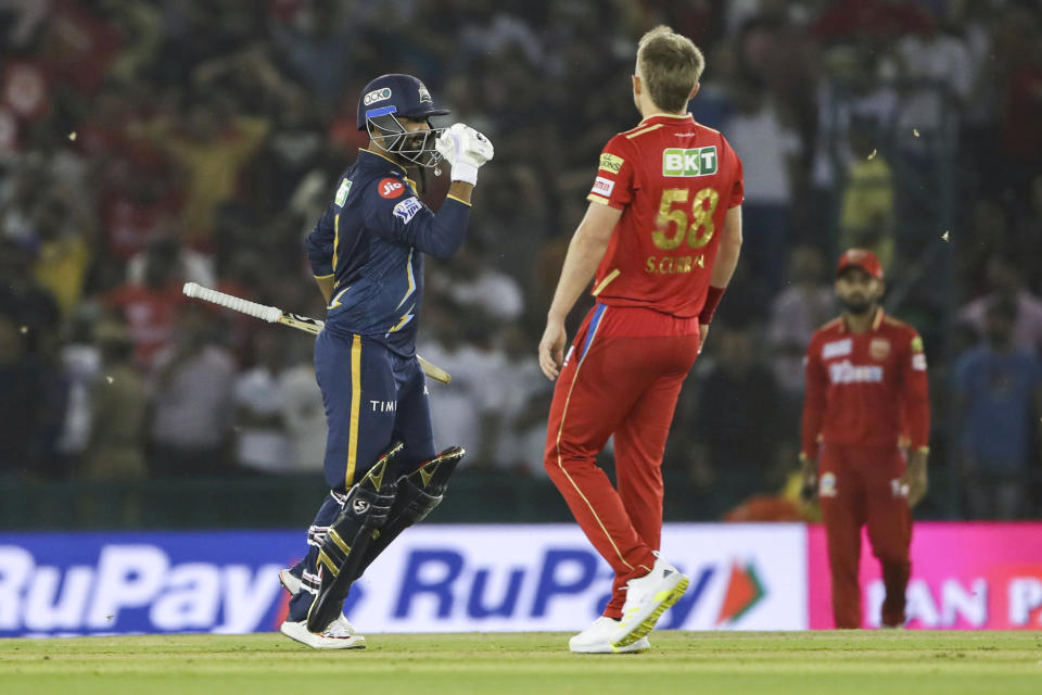 Rahul Tewatia of Gujarat Titans celebrates after winning the Indian Premier League cricket match between Punjab Kings and Gujarat Titans in Mohali, India, Thursday, April 13, 2023. (AP Photo/ Surjeet Yadav)