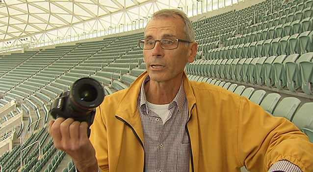 Drew Lanman shows off one of his cameras used to capture his time lapse marvel. Photo: 7News.