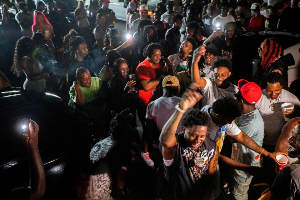 Real Boston Richey sings and dances with friends and fans as he records a music video in Tallahassee, Fla. on Monday, Aug. 15, 2022. 