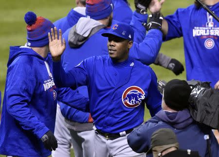 Oct 26, 2016; Cleveland, OH, USA; Chicago Cubs relief pitcher Aroldis Chapman (middle) celebrates with teammates after defeating the Cleveland Indians in game two of the 2016 World Series at Progressive Field. David Richard-USA TODAY Sports