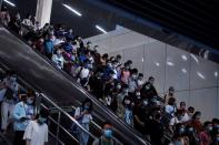 People walk at a subway station, following the outbreak of the coronavirus disease (COVID-19), in Shanghai