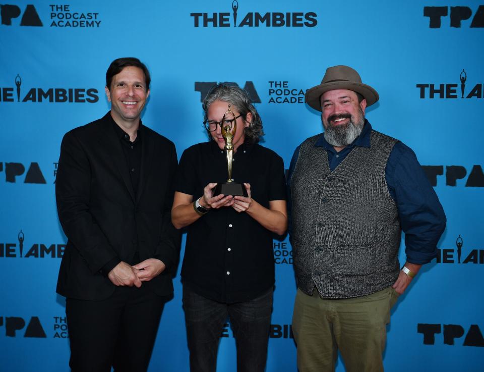 Photo of Josh Clark, left, Chuck Bryant, right, and producer Jeri Rowland at an award show.