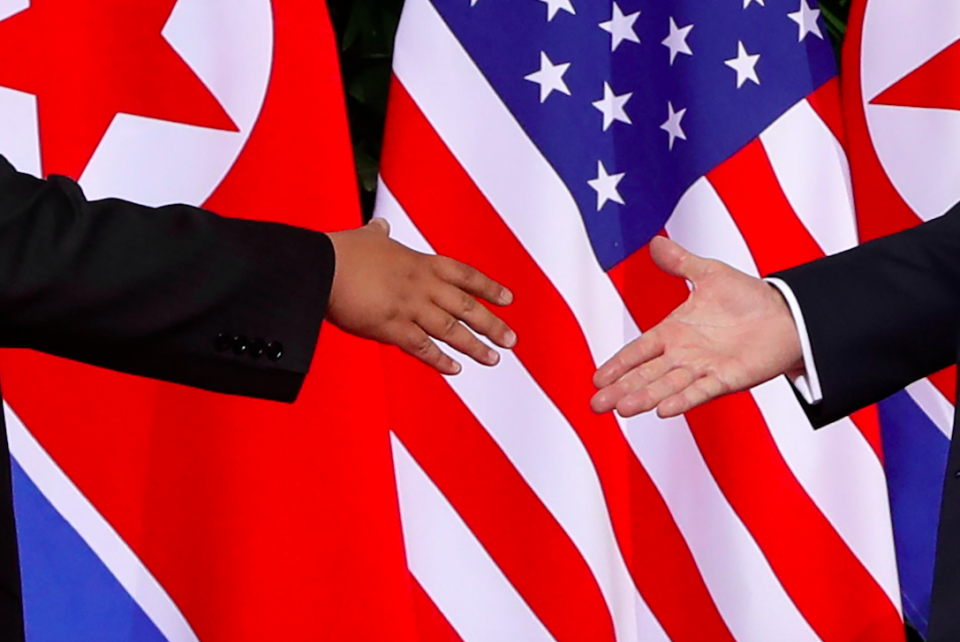 The historic handshake between Mr Kim and Mr Trump (Picture: PA)