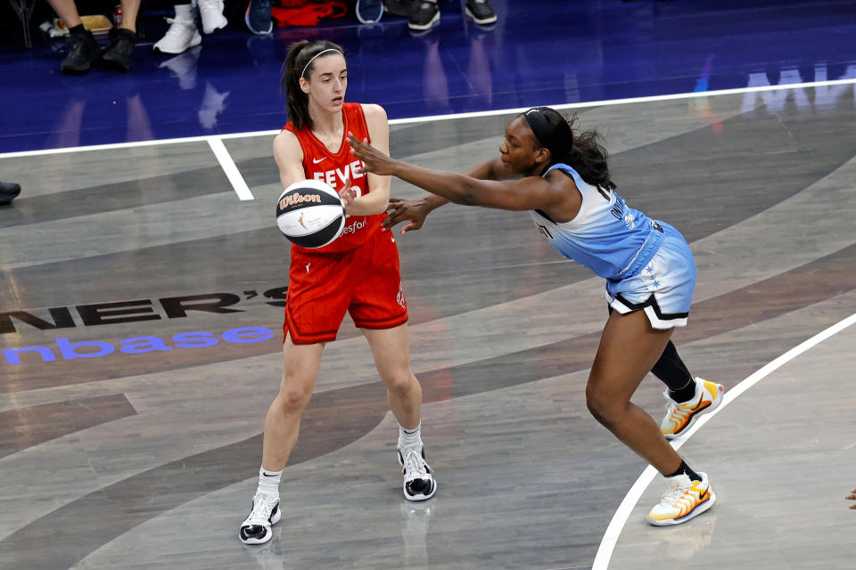 INDIANAPOLIS, IN - JUNE 01: Indiana Fever guard Caitlin Clark (22) makes a pass against  Chicago Sky guard Michaela Onyenwere (12) on June 1, 2024, at Gainbridge Fieldhouse in Indianapolis, Indiana. (Photo by Brian Spurlock/Icon Sportswire via Getty Images)