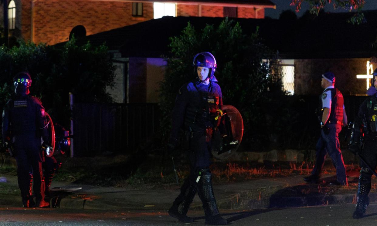 <span>Police outside the Christ the Good Shepherd church in Wakeley after disturbances on Monday night.</span><span>Photograph: Paul Braven/EPA</span>