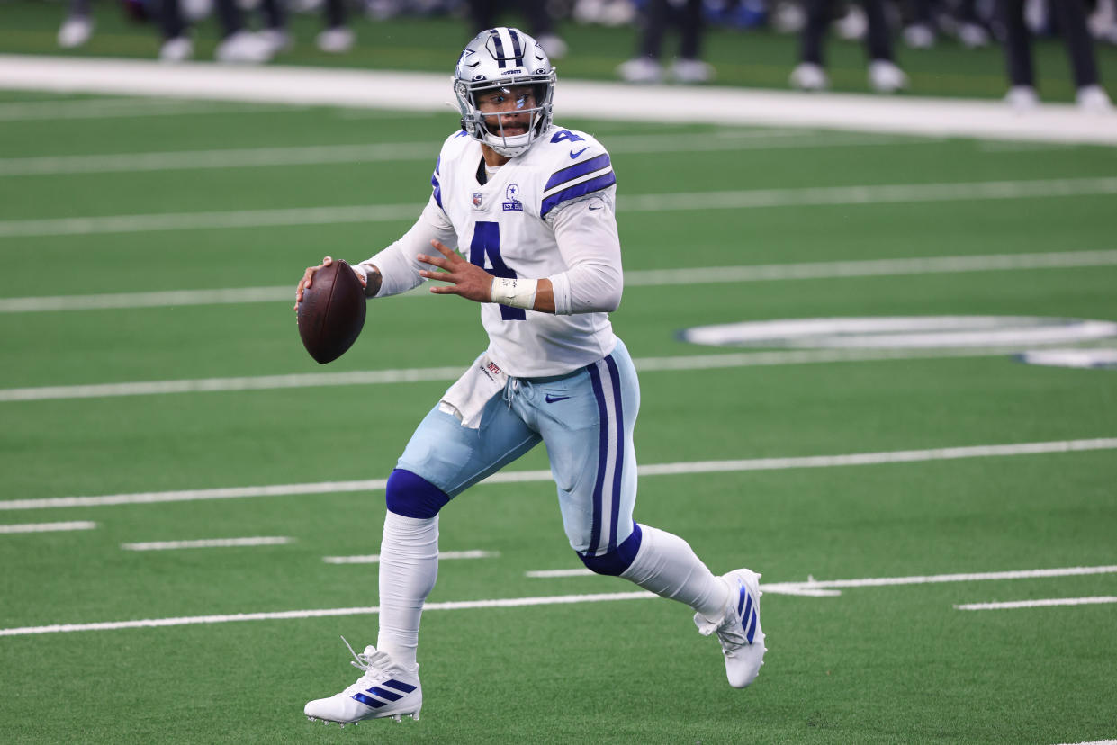 ARLINGTON, TEXAS - OCTOBER 11:  Dak Prescott #4 of the Dallas Cowboys attempts a pass against the New York Giants during the second quarter at AT&T Stadium on October 11, 2020 in Arlington, Texas. (Photo by Tom Pennington/Getty Images)