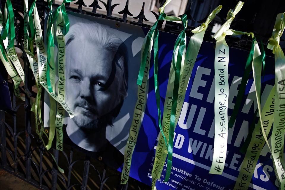 A banner placed by a supporter of WikiLeaks founder Julian Assange, is pictured on the railings outside The Royal Courts of Justice, Britain's High Court, in central London on May 20, 2024.