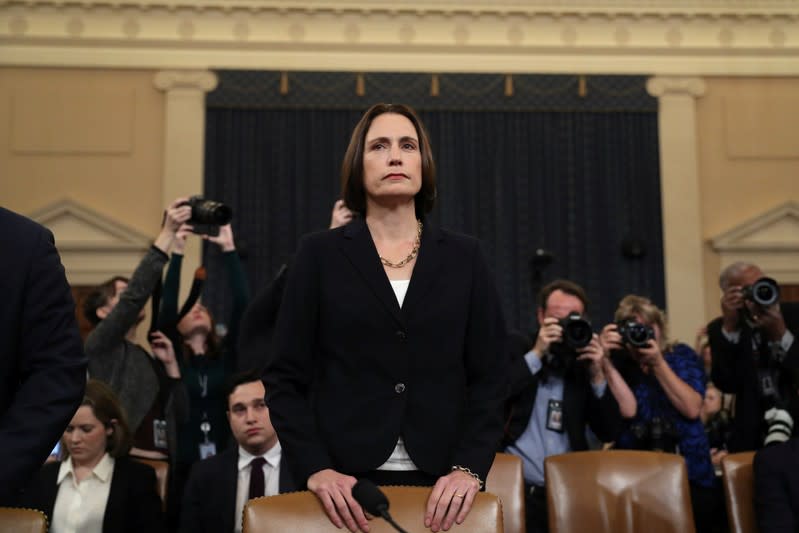 Fiona Hill takes her seat before she testifies in front of the House Intelligence Committee hearing as part of Trump impeachment inquiry on Capitol Hill in Washington