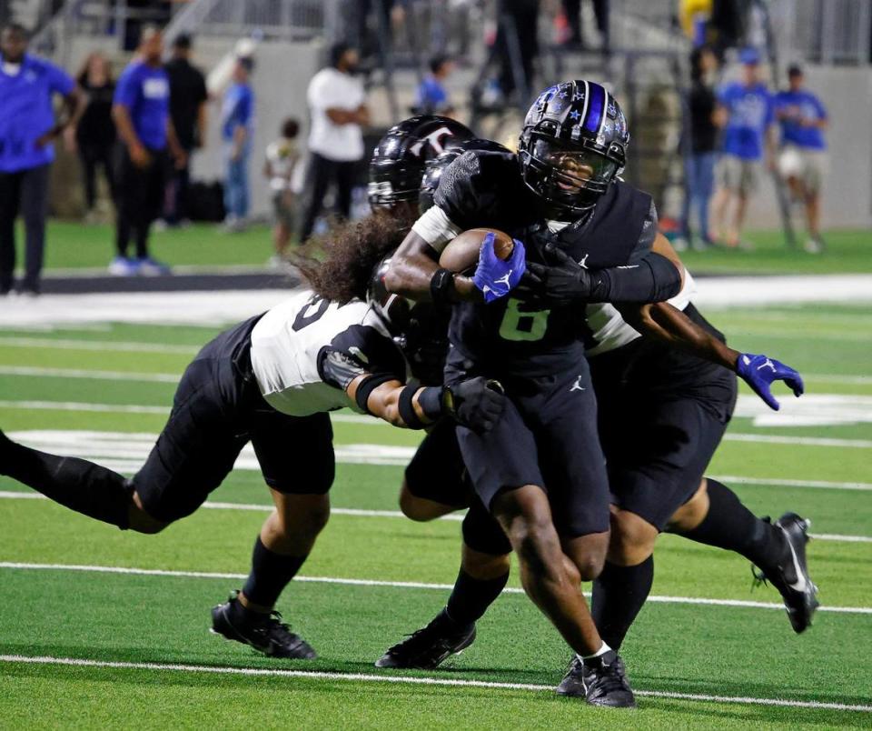 North Crowley running back Ashton Searl (8) gains a few yards in the first half of a UIL high school football game at Crowley ISD Multi-Purpose Stadium in Crowley, Texas, Friday, Sept. 22, 2023.