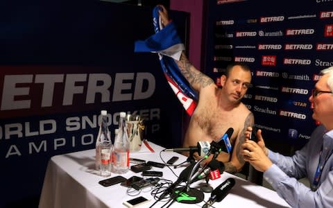 Mark Williams conducts his post match interview without any clothes after winning the 2018 Betfred World Championship at The Crucible, Sheffield - Credit: PA