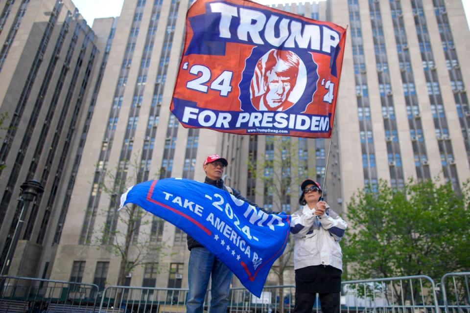 Supporters of former President Donald Trump stand outside Manhattan criminal court building, Monday, April 22, 2024, in New York (AP)